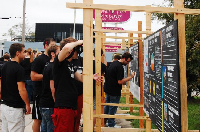 Students build 4' x 8' chalkboard panels to solicit feedback about specific issues from the community at Mid City Speaks.