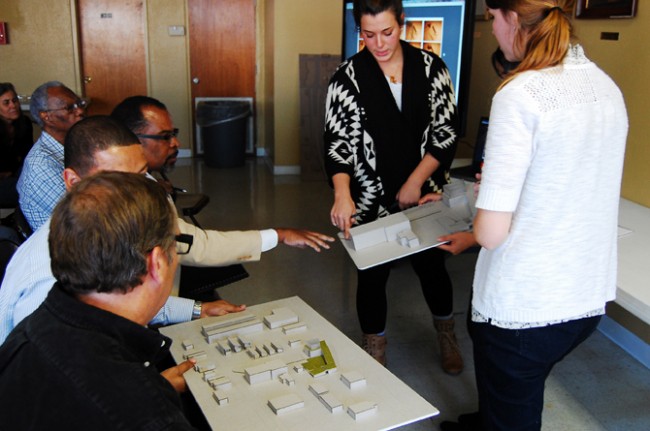 Fourth-year LSU students Jeanette Feinberg, Eva Rodriguez, and Christine Nguyen discuss models with (left to right) Assistant Minister Roy Simms and Pastor Dale Flowers of New Sunlight Baptist Church, Sam Sanders of the Mid City Redevelopment Alliance, and Chip Boyles of the East Baton Rouge Redevelopment Authority.