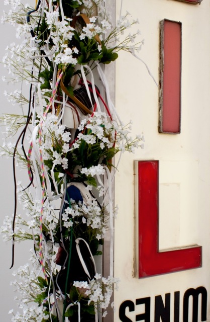 Sign with flowers, lsu museum of art rooted communities