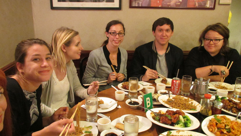 Students at table with Chinese food