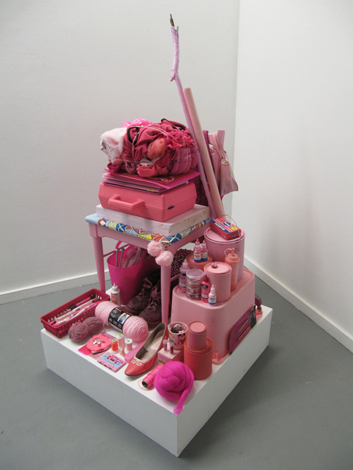 Many pink items including suitcase, shoe, yarn, bucket, thread.Kit French LSU MFA Thesis