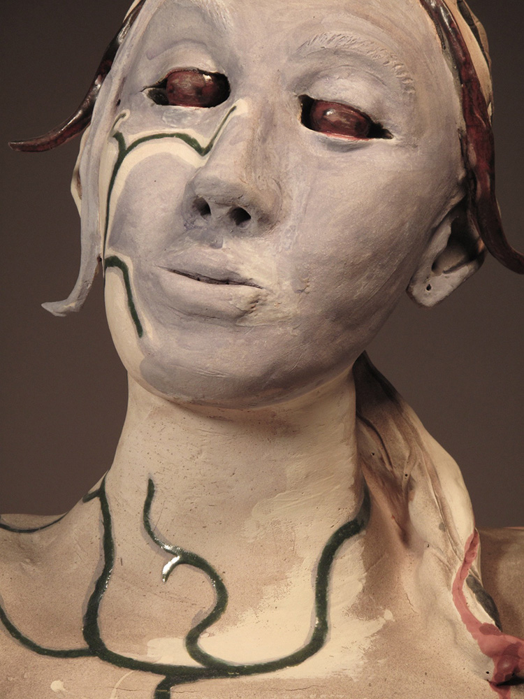 Woman with green veins on neck, face.LSU BFA Studio Art Ceramics