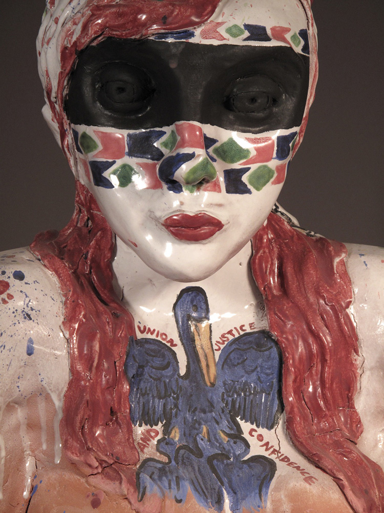 Woman in eye mask, bird design on chest, LSU BFA Studio Art Ceramics