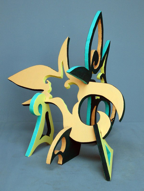 Puzzle sculpture with gree, peach, black panels.LSU BFA Studio Art Sculpture