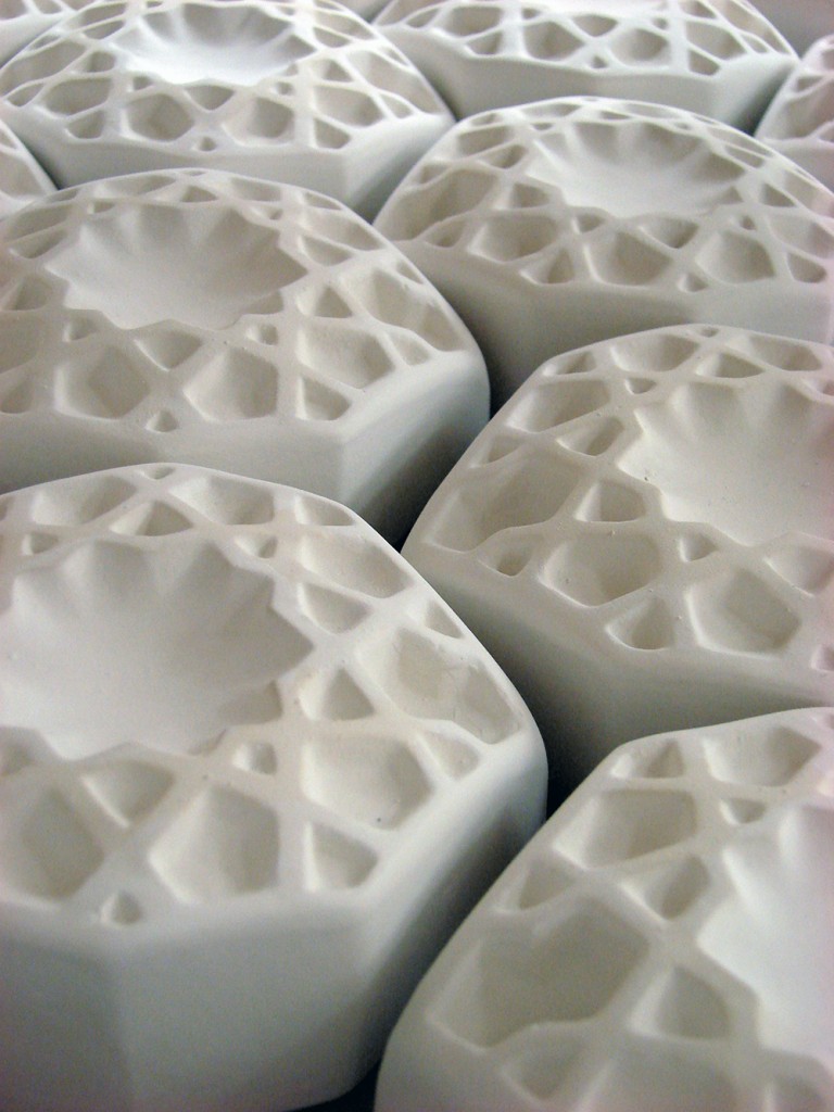 Identical white pieces fitted together, LSU BFA Studio Art Ceramics