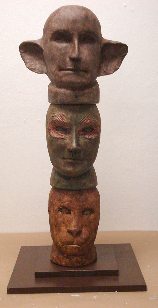 Totem pole with animalistic humanoid faces, LSU BFA Studio Art Ceramics