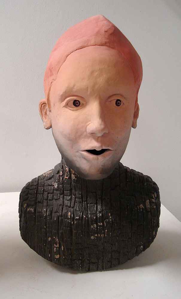 Bust with pink head, black torso.LSU BFA Studio Art Ceramics