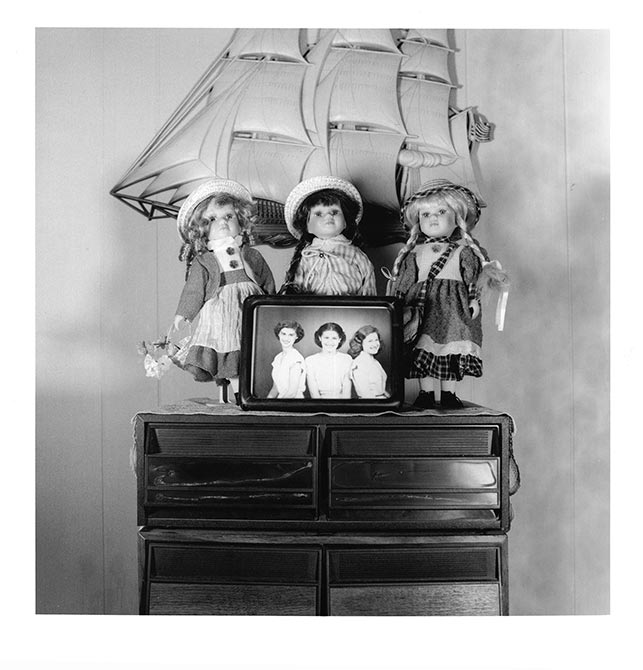 Dolls and model ship on shelf.lsu intermediate photography