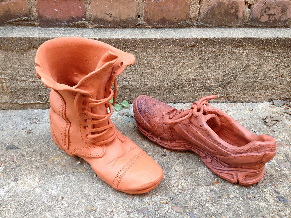 Ceramic leather boot and running shoe, LSU BFA Studio Art Ceramics