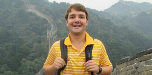 Young man, Great Wall in background