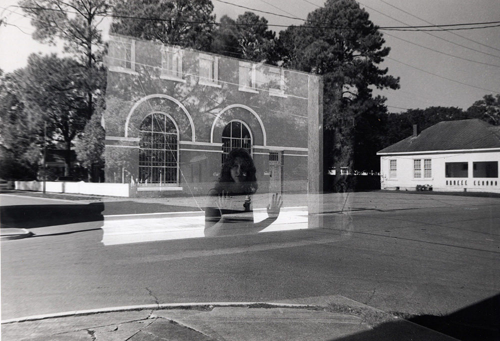 Reflection of woman in window