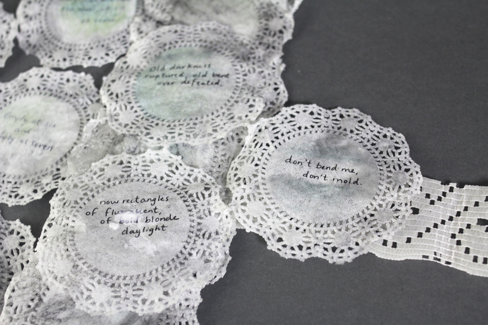 Paper doilies with quotes penned.LSU BFA MFA Studio Art Printmaking Book Arts