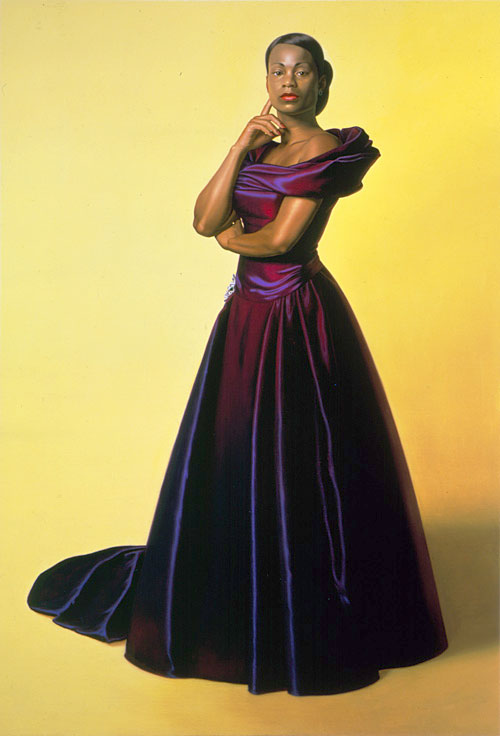 black woman in purple gown, yellow background