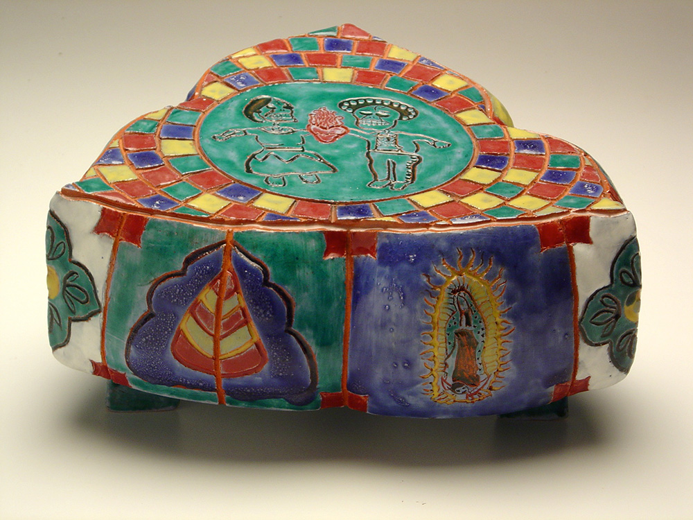 Colorful ceramic with Day of the Dead figures, and tiles in red, blue, and yellow.LSU BFA Studio Art Ceramics