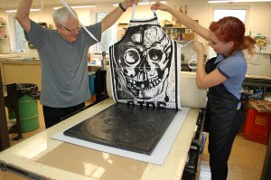 lsu school of art visiting artist making skull print on apron