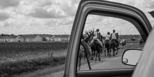 Photo of people riding horses by Jeremiah Ariaz