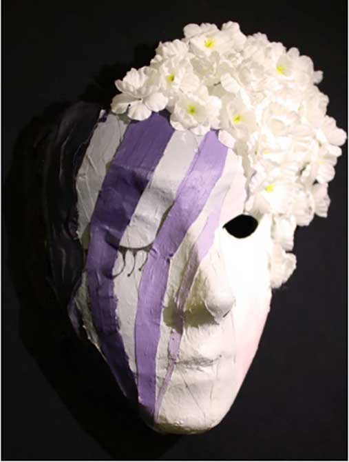 paper mache mask with purple stripes