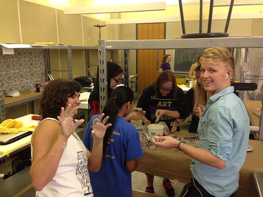 lsu interior design students work with plaster