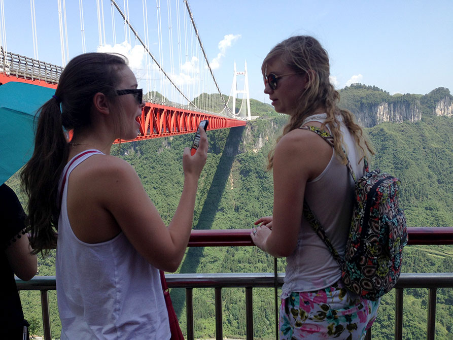 Students by mountain bridge