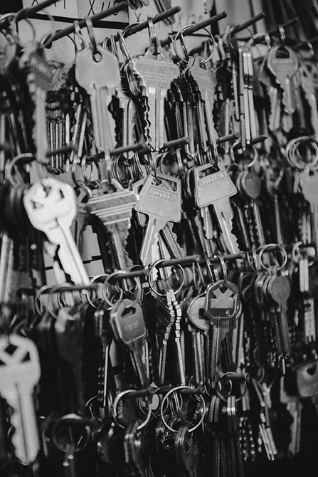 Dozens of keys hang from rows of nails