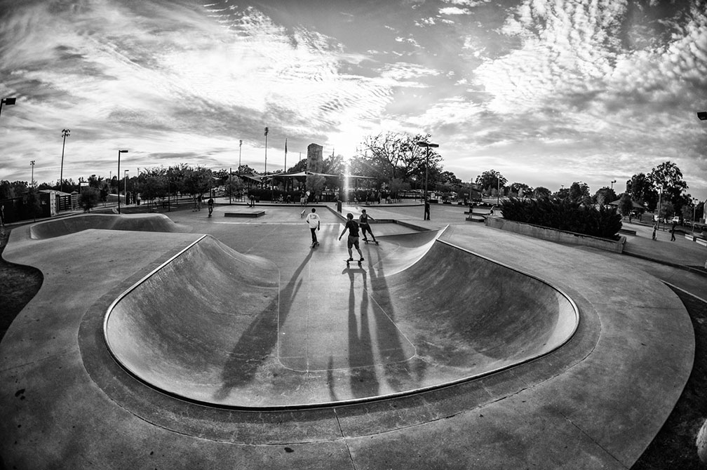 Three men in skatepark