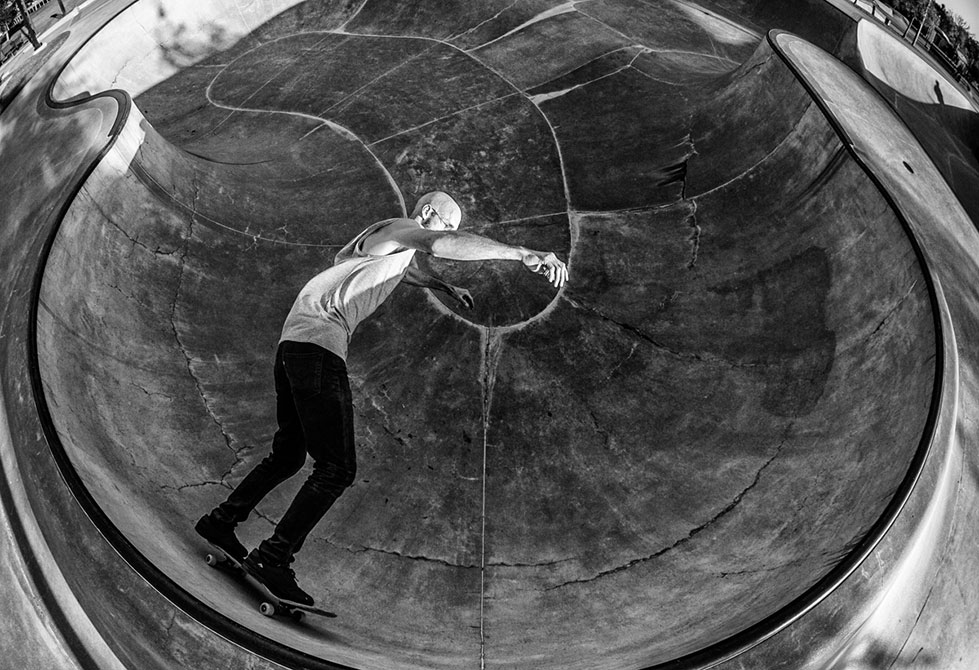 Black and white photo of man skateboarding