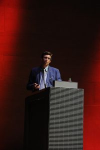 Professor Darius Spieth speaks at the Louvre