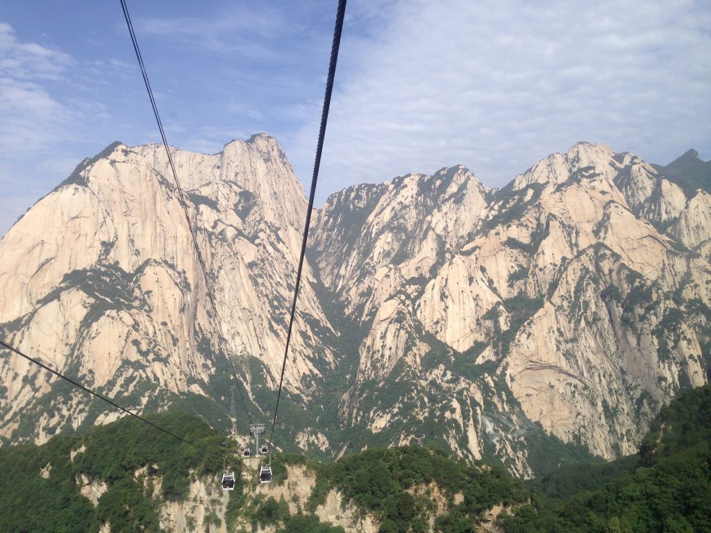 View of mountains from cable car over the valley