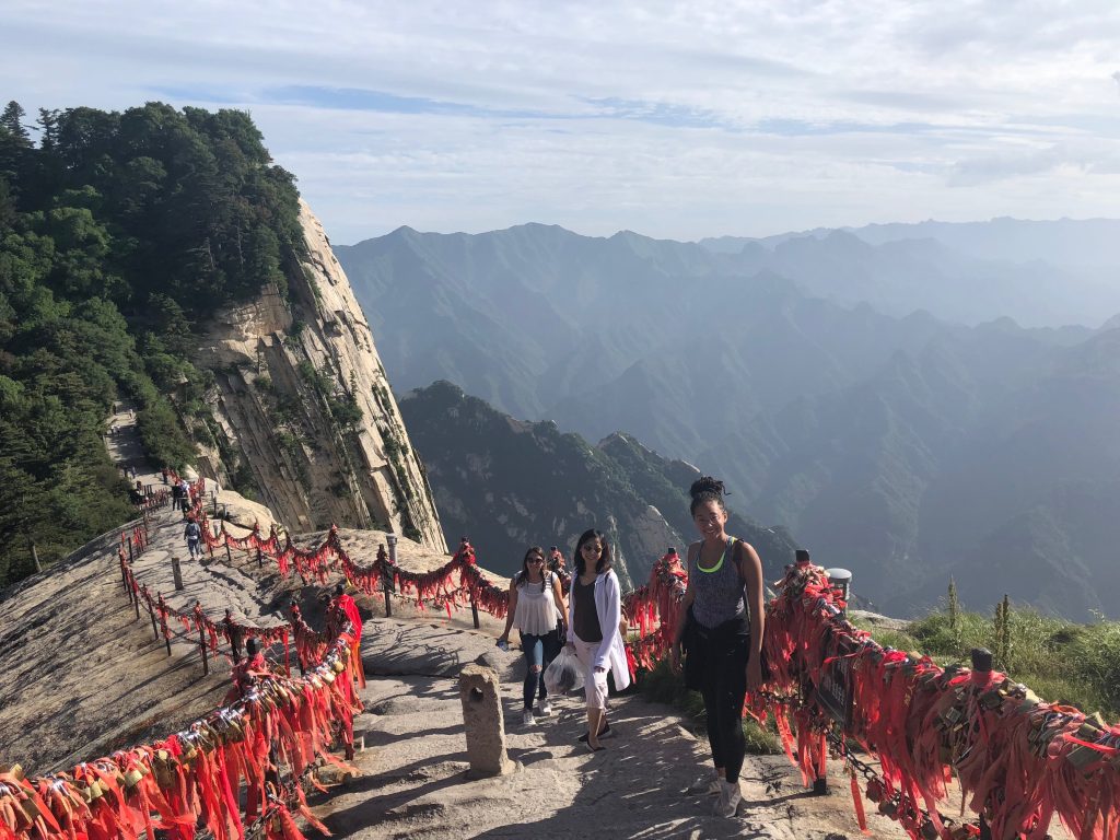 Girls on path with mountain views