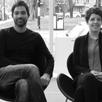 Suresh Perera & Julie Charbonneau sit for a photo in adjacent chairs