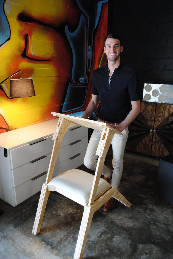 Young man with chair