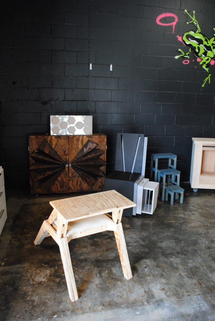 furniture by black brick wall