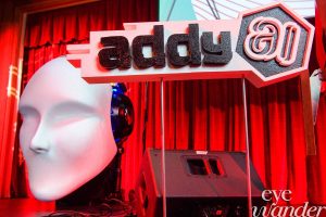 ADDY Awards stage with red curtain, statue