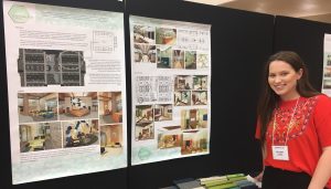 Female student by poster presentation