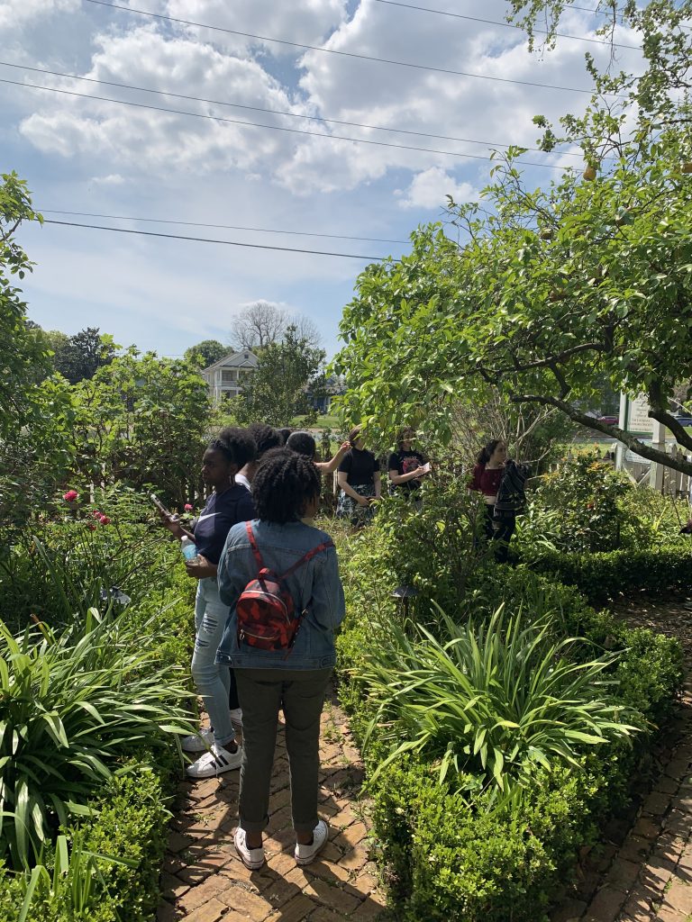 Students in lush garden