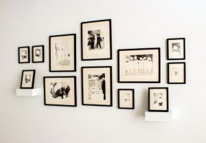 Black and white photographs on white wall