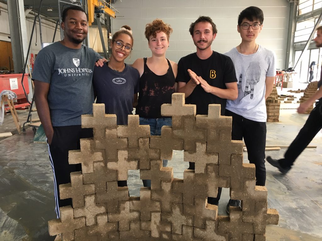 students with earth bricks