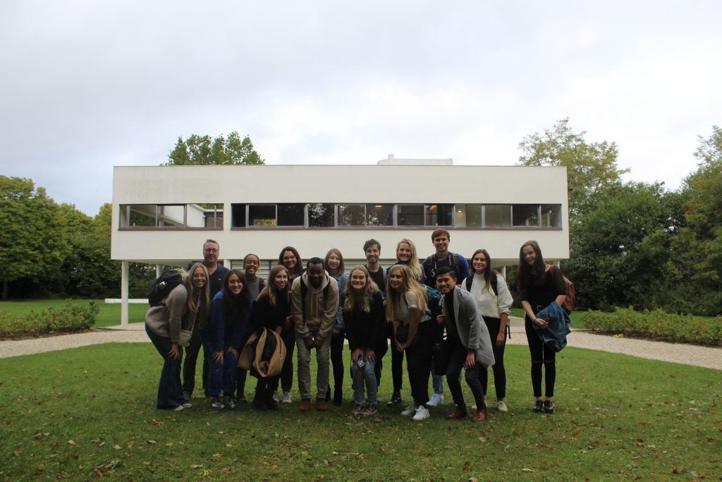 group in front of modern building