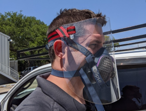 man wearing face shield