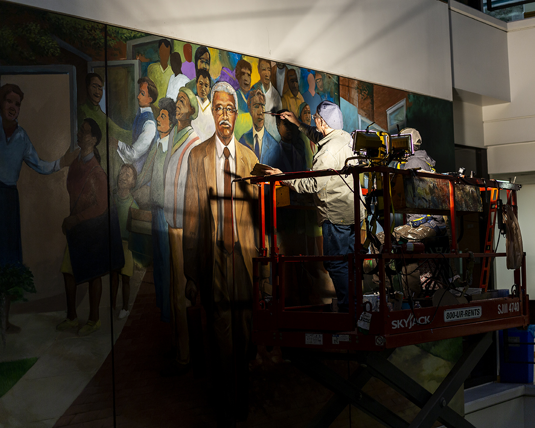 Man painting mural