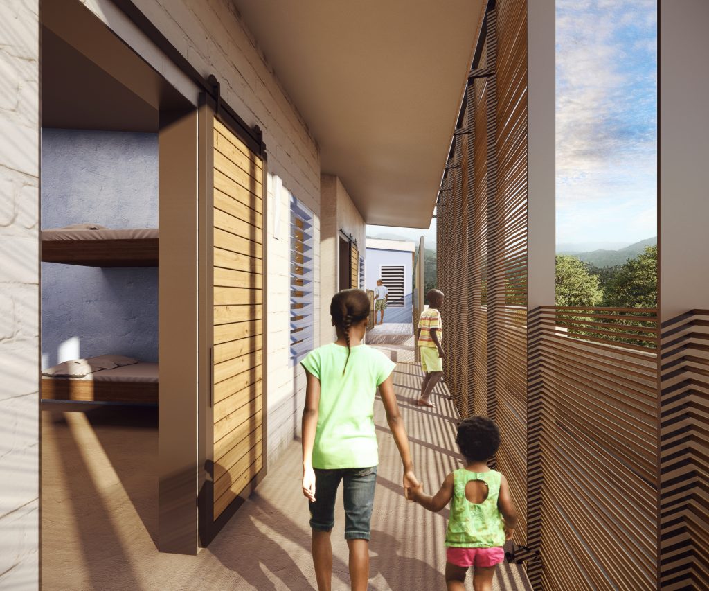 Children walking on second floor exterior corridor.