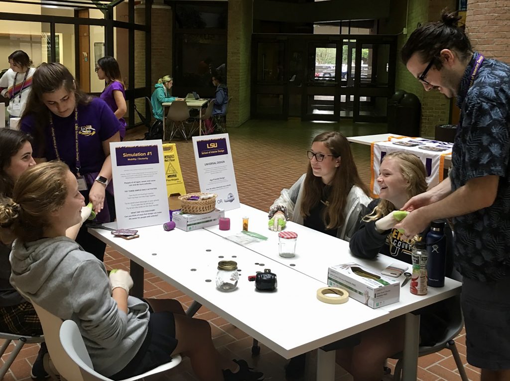 Students at table, in discussion.