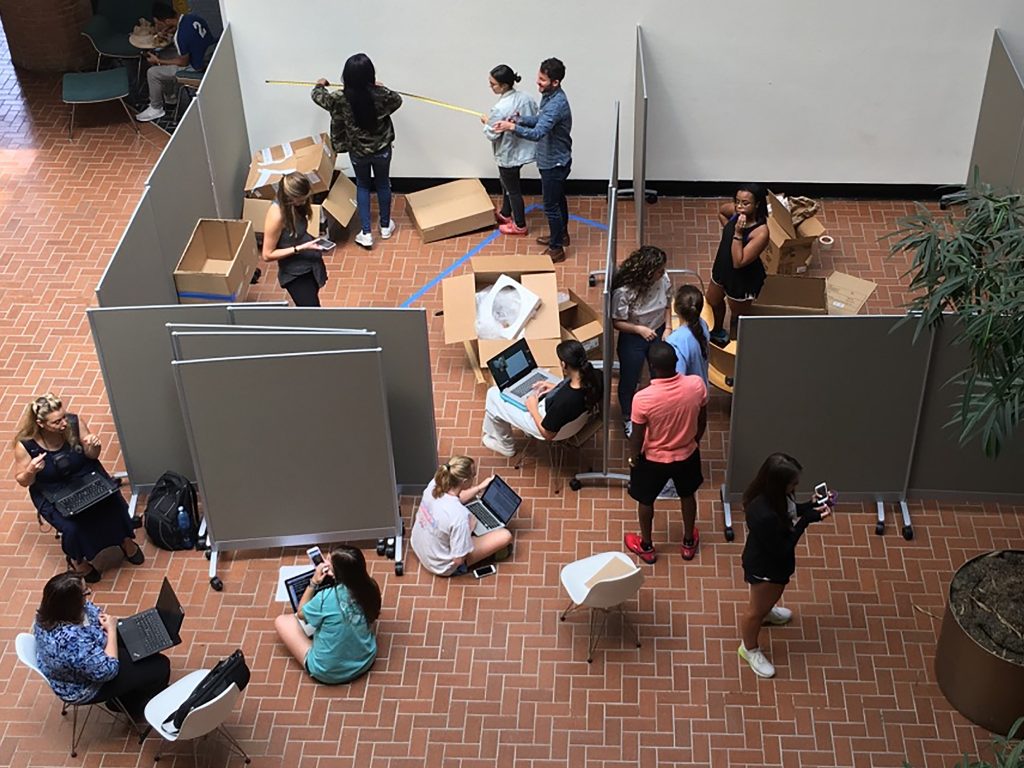 Aerial view of students building space with walls.