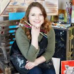 Jessica Young with paintbrushes