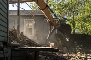 Photo of bulldozer demolishing building, by Johanna Warwick