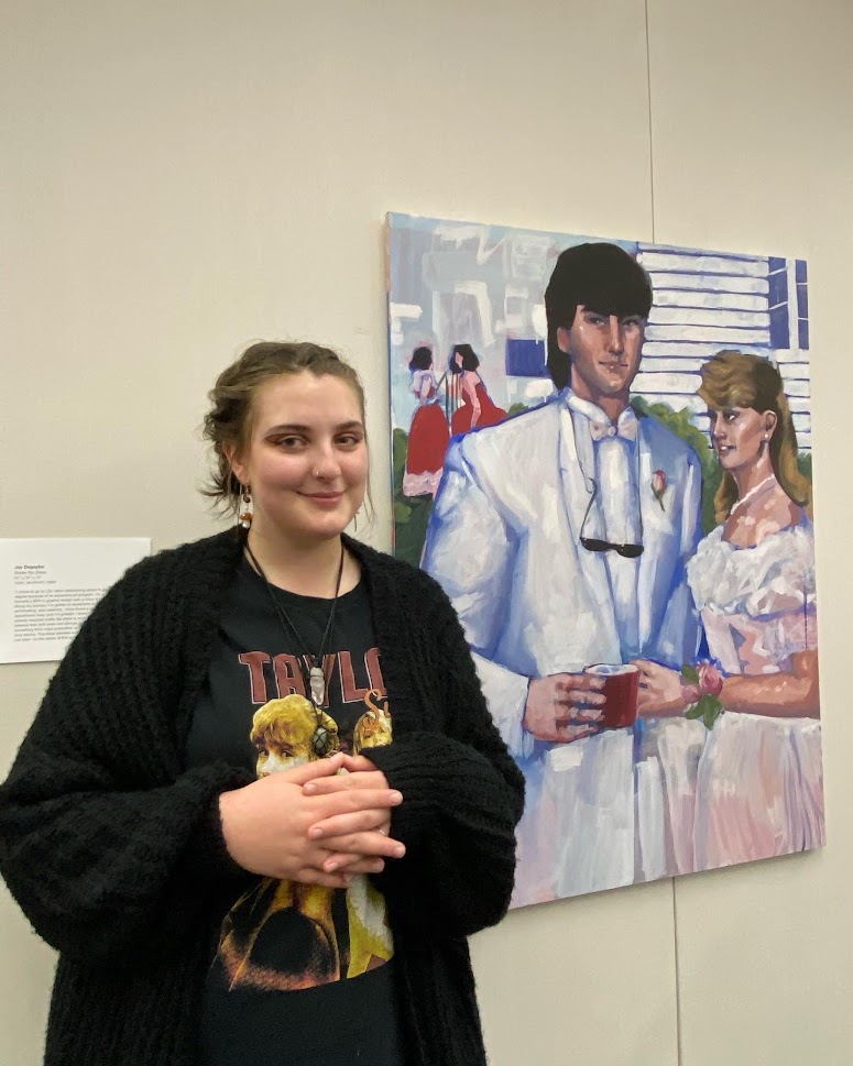 young woman by painting of couple