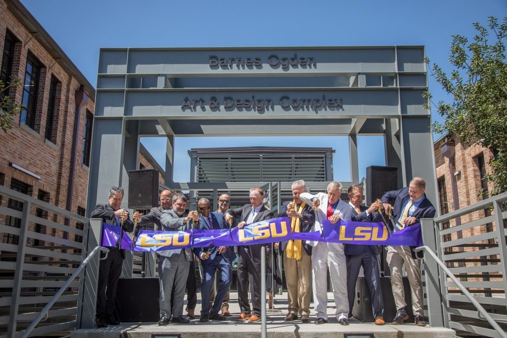 Purple LSU ribbon cut in front of Barnes Ogden building