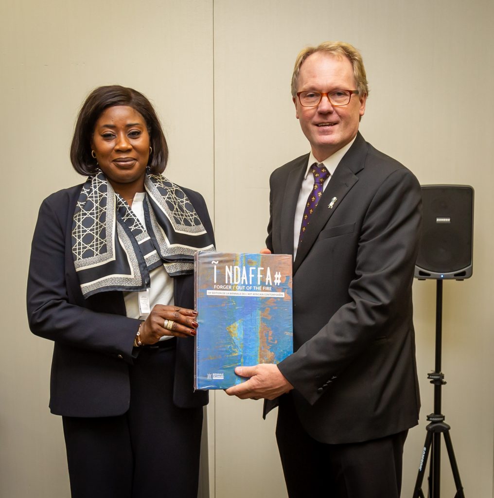 Provost holding book