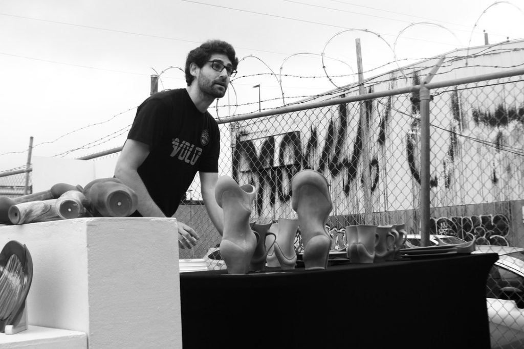 Richard with clay pieces outside.Black and white portrait