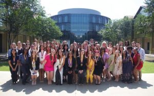 Distinguished Communicators students outside Ourso building on lsu campus